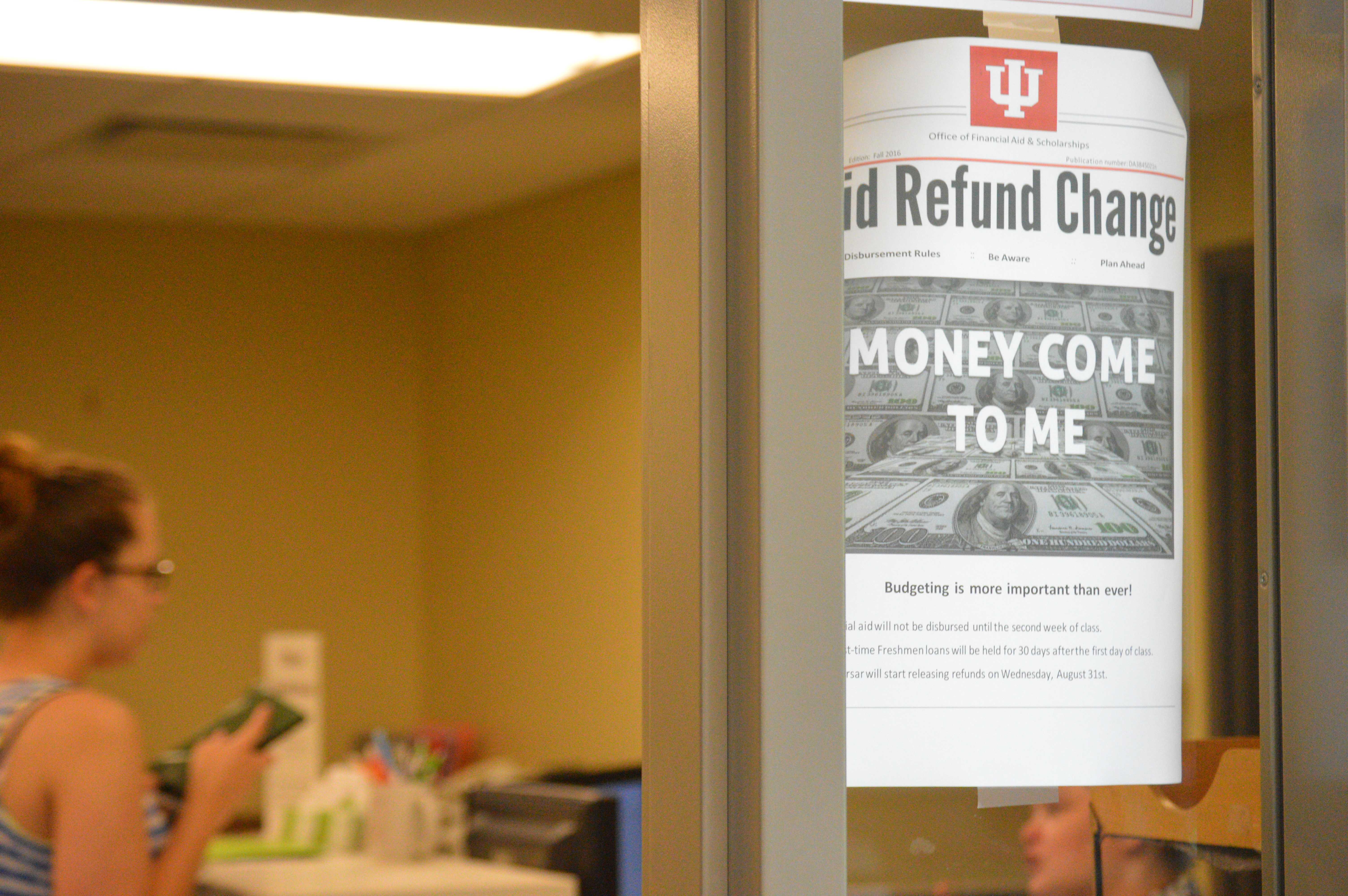 Flyers informing students of changes in financial aid policies adorn the wall of the Education and Arts Building, the temporary home of the Office of Financial Aid and Scholarships. PHOTO/C.A. PRINTUP