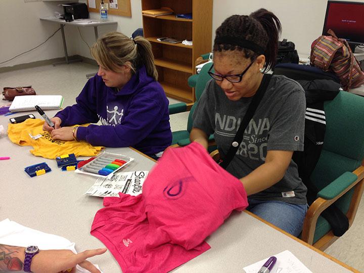 Students participate in the clothesline project to bring awareness to domestic violence. Preface photo/NATALIE MILLS