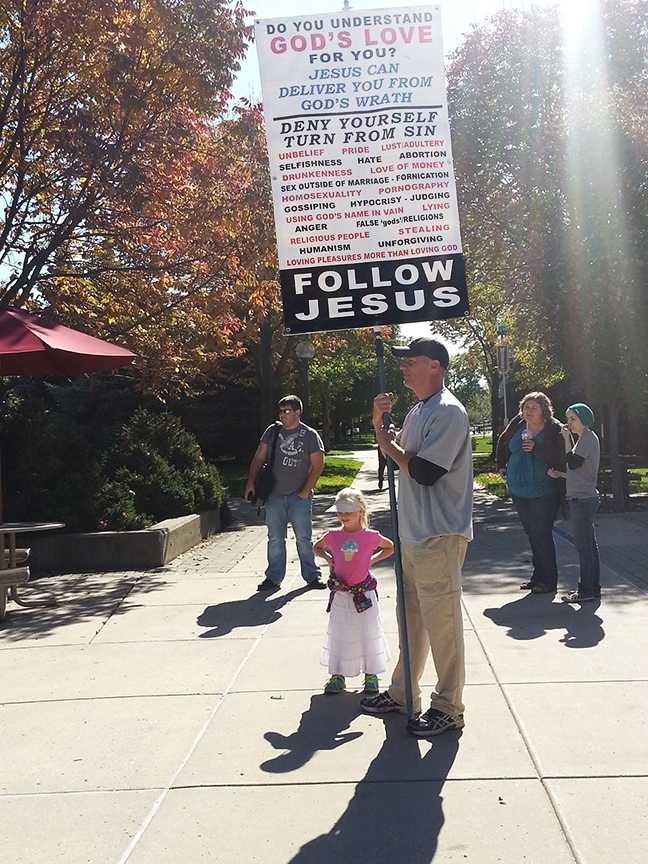 Steve stood quietly with his sign for most of the day, alongside his young daughter.
