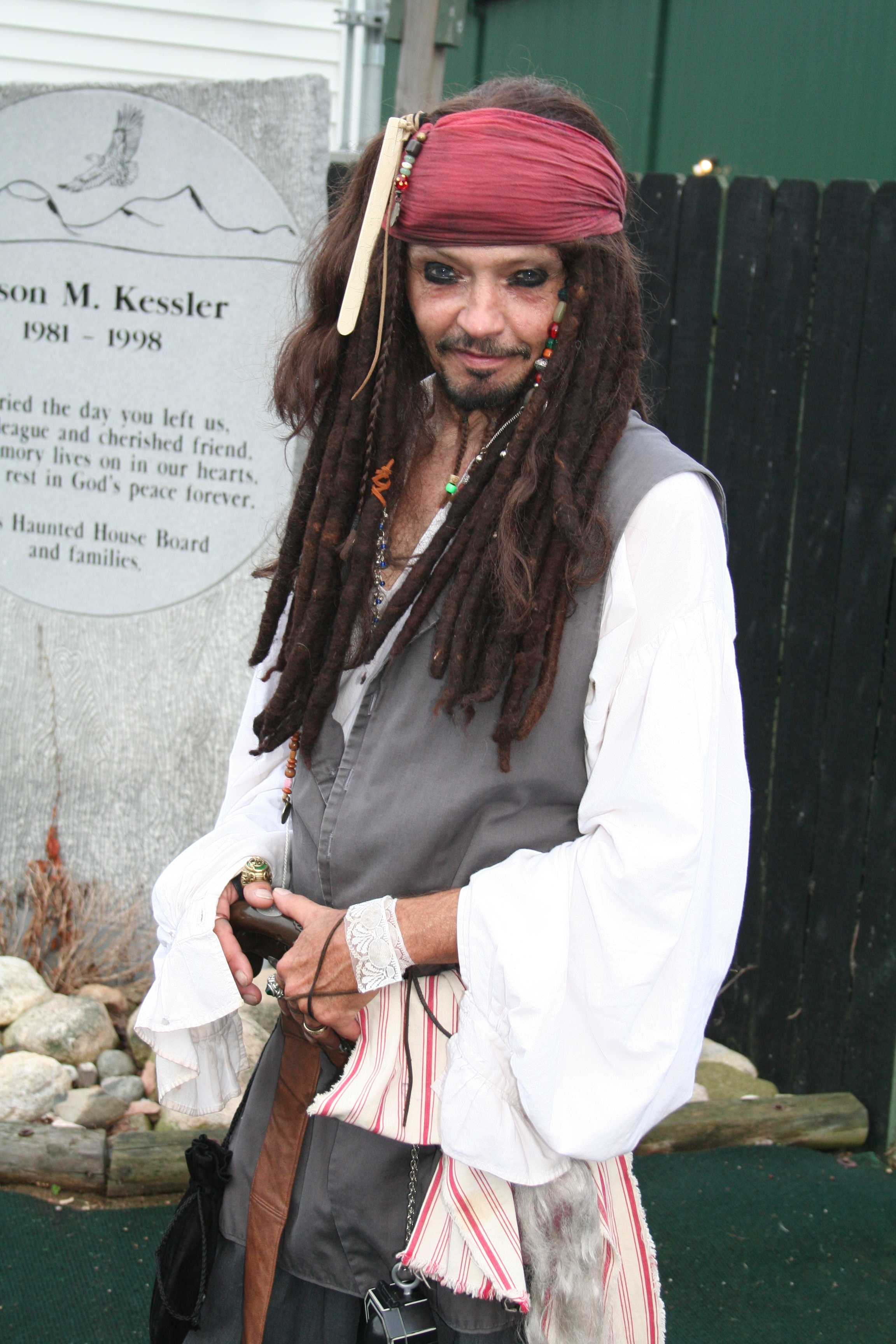 Captain Jack Sparrow, played by Dennis Davis, poses for a moment between entertaining haunt's guests. Preface photo/ KELSIE FERGUSON