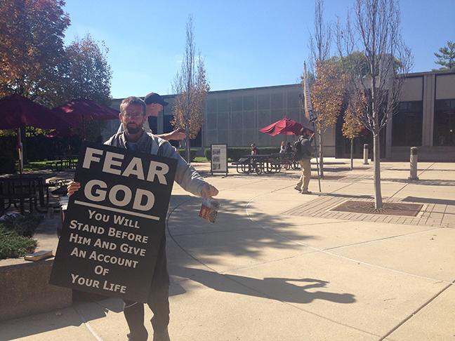 Brad, one of several religious protesters on campus Monday. (Photo by Taylor Neff)