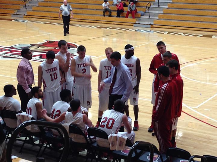 Coach Scott Cooper talks to his team during a timeout in the first half. (Preface photo/NEIL KING)