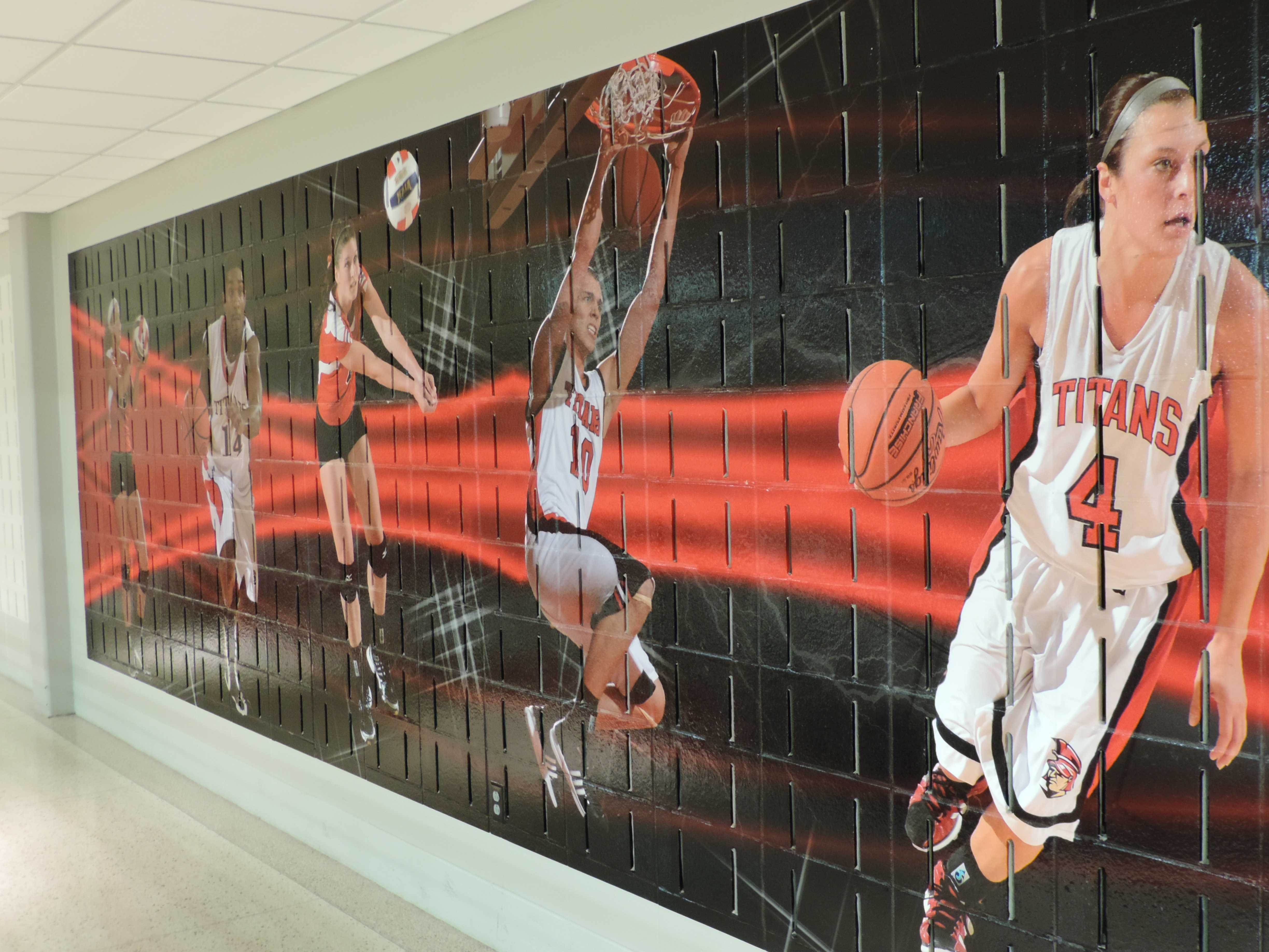 A mural in the SAC may be added to in order to include three new sports. (Preface photo/ Neil King)