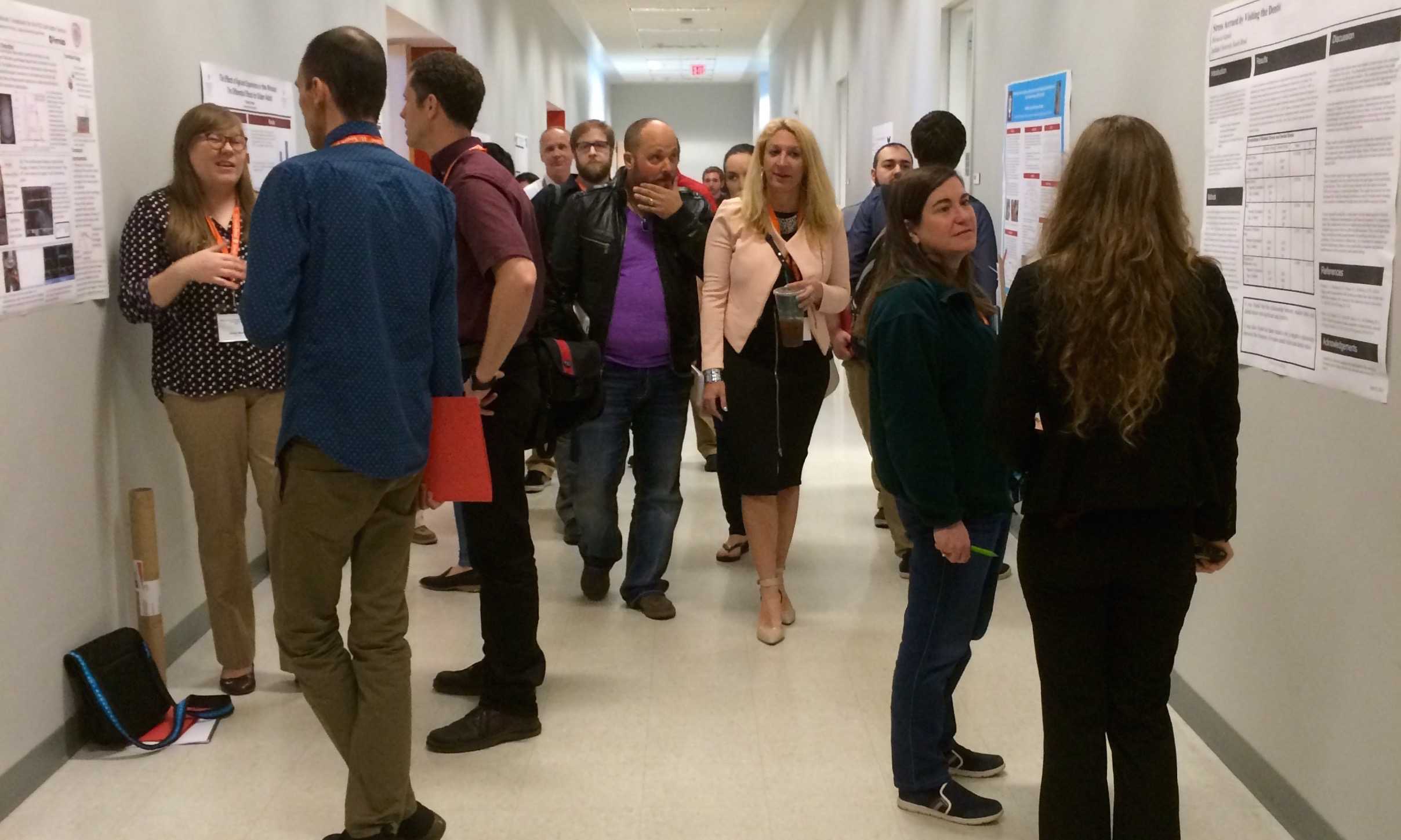 Poster presentations line the walls of the South Wiekamp Hall where students talk about their research endeavors with guests Friday, April 17, 2015. Preface photo/Bri Schmitt