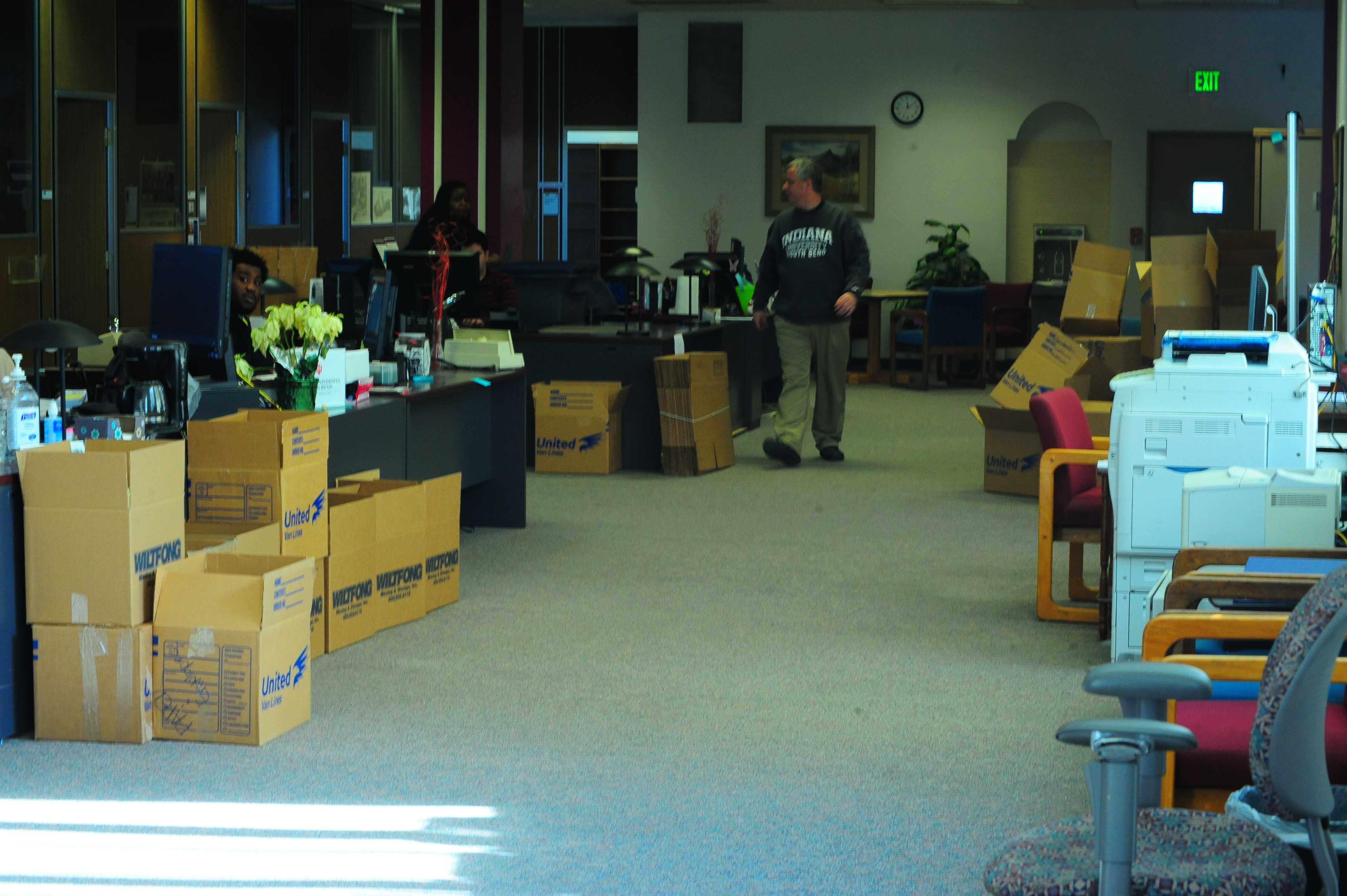 Boxes are stacked and ready to move in a hallway that once housed the Office of Financial Aid and Scholarships and the Office of the Registrar. Both offices are temporarily located in the Education and Arts Building. Photo Credit/Michael Montana