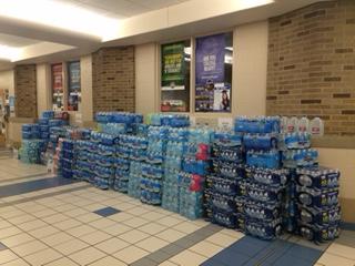 Cases of bottled water line the hallways of John Adams High School.
Photo Credit/Gabriela Gil