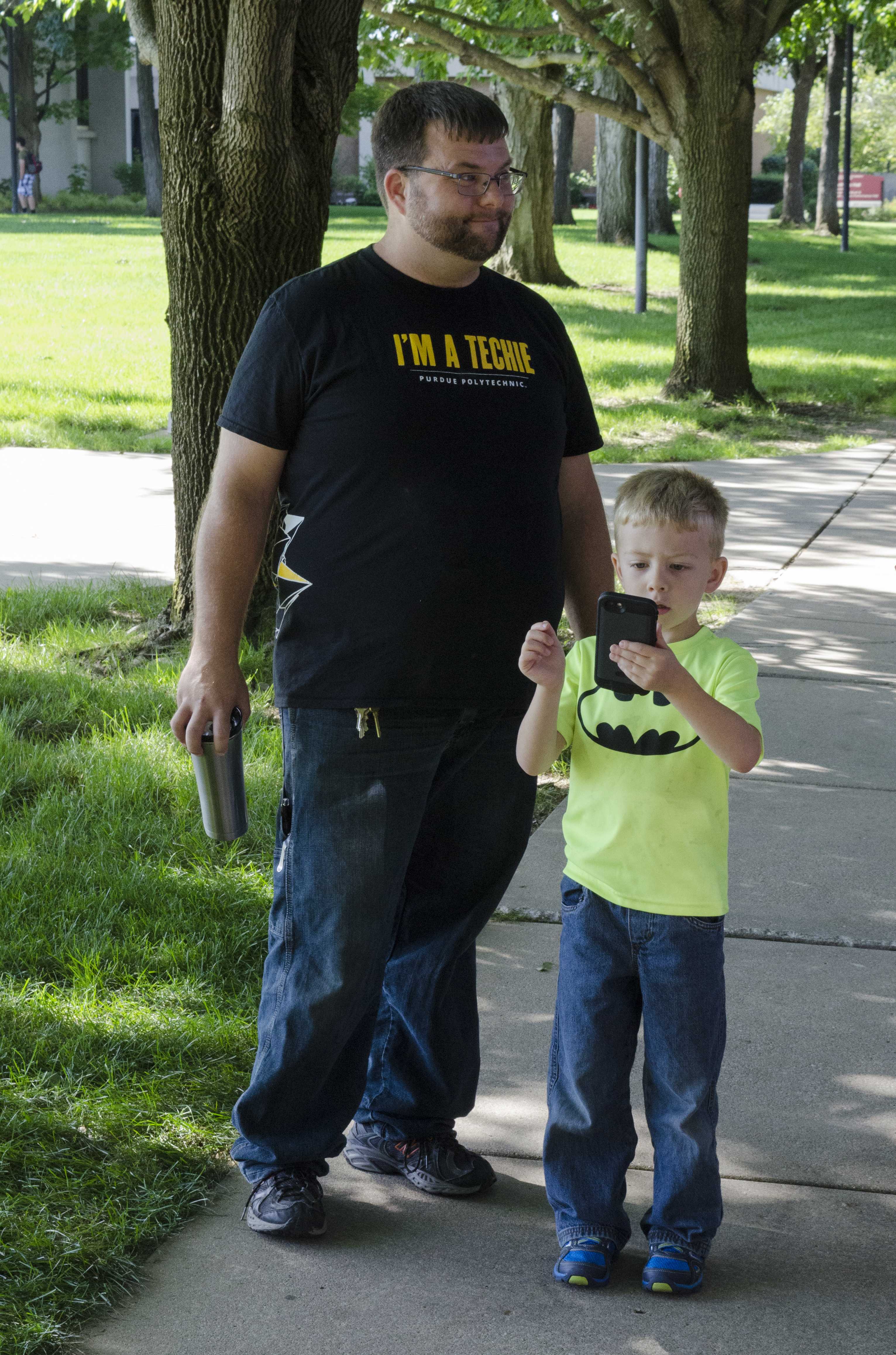 A young Pokemon Go trainer searches the campus mall for Pokemon during the Welcome Back Fair. PHOTO/LEAH FICK