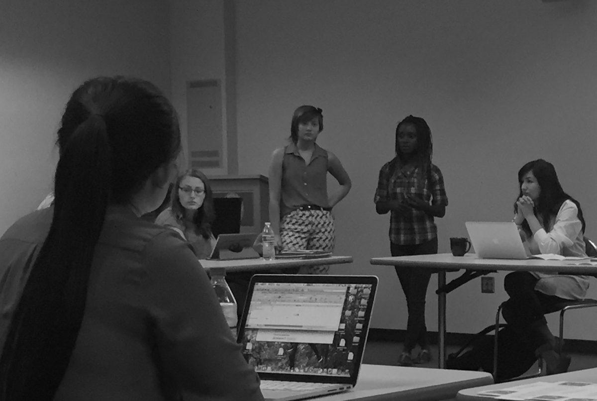 Sophomores Mimi Svoboda (standing right) and Iyoma Eden (standing left) present a funding request for their Chi Alpha Christian Fellowship group to the SGA senate Friday, Sept. 24. PHOTO/RYAN LOHMAN