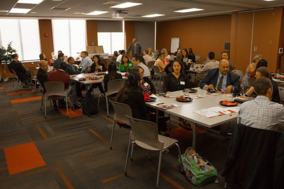 Judd Leighton School of Business students eating lunch with their new mentors. PHOTO/Ian Brown 