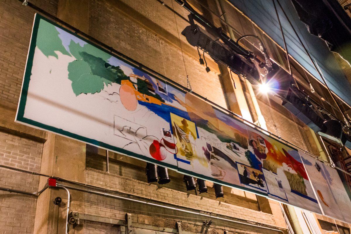 The Art of Sustainability’s Class mural hangs in the Auditorium in Northside Hall while it is being worked on. PHOTO/Brandon Krutsch
