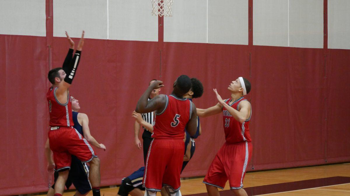 L-R #1 T.J. Benner, #5 Myluv Sutton, and #33 Taylor Brooks prepare to take the ball after the Warriors make a basket. PHOTO/Sarah Whitehead