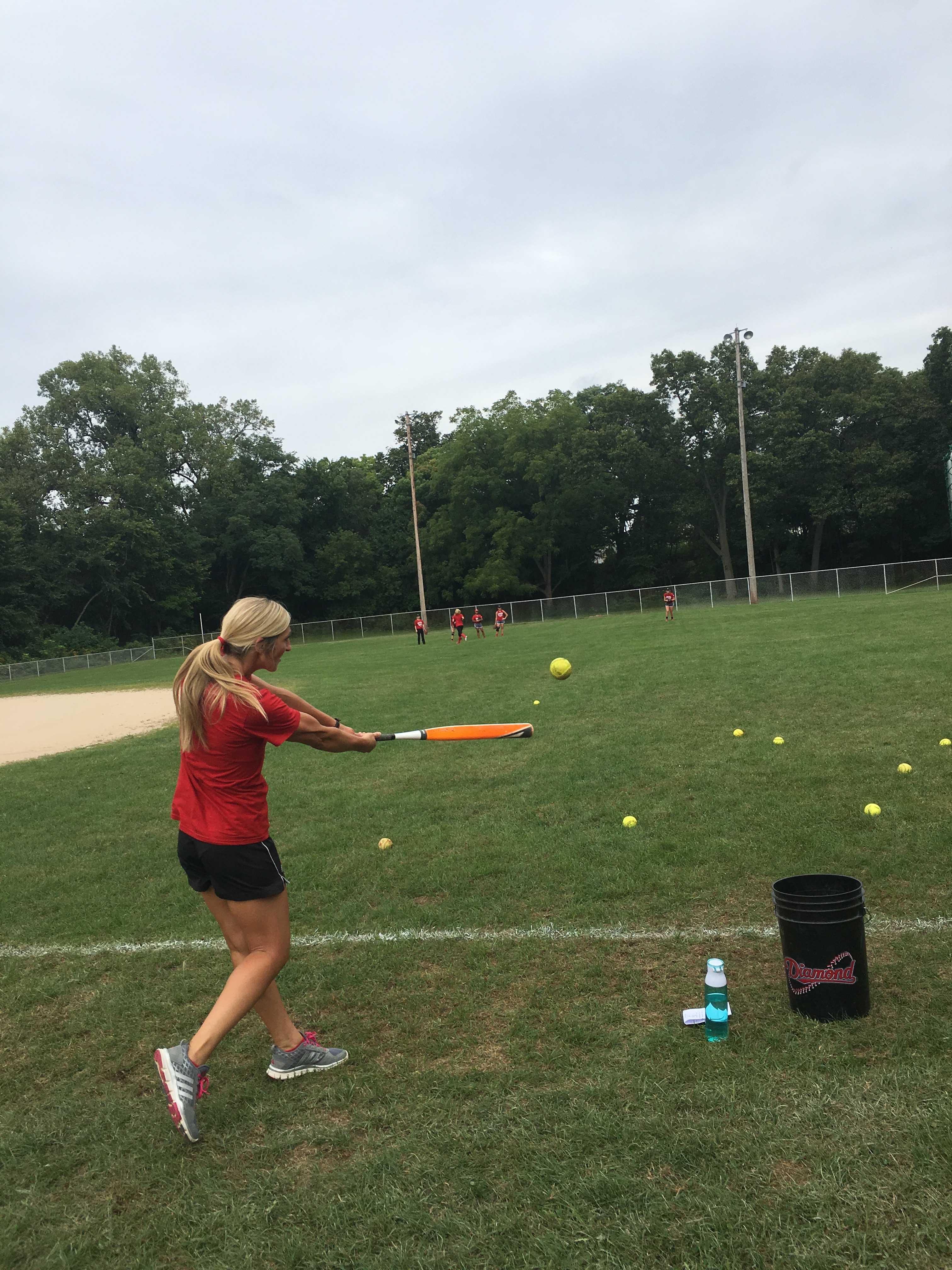 Coach Brittney Lightfoot runs pop fly drills with her outfielders. PHOTO/Casey McDonald