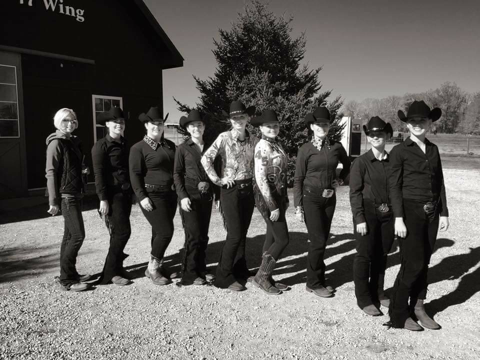Equestrian team in full canter