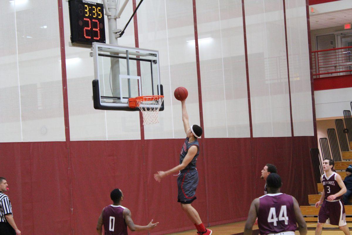 Junior Taylor Brooks goes up for the smooth dunk as he helps put the Titans up at halftime.
Photo/CASEY MCDONALD