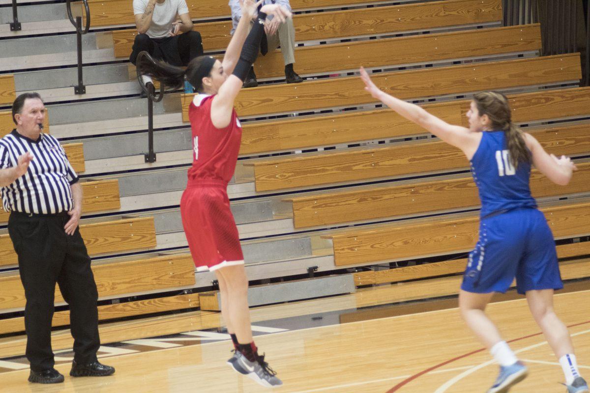 The 5-foot-11 freshman, Vicki Gard knocks down a triple, putting her on top as point leader for the game.
Photo/CASEY MCDONALD
