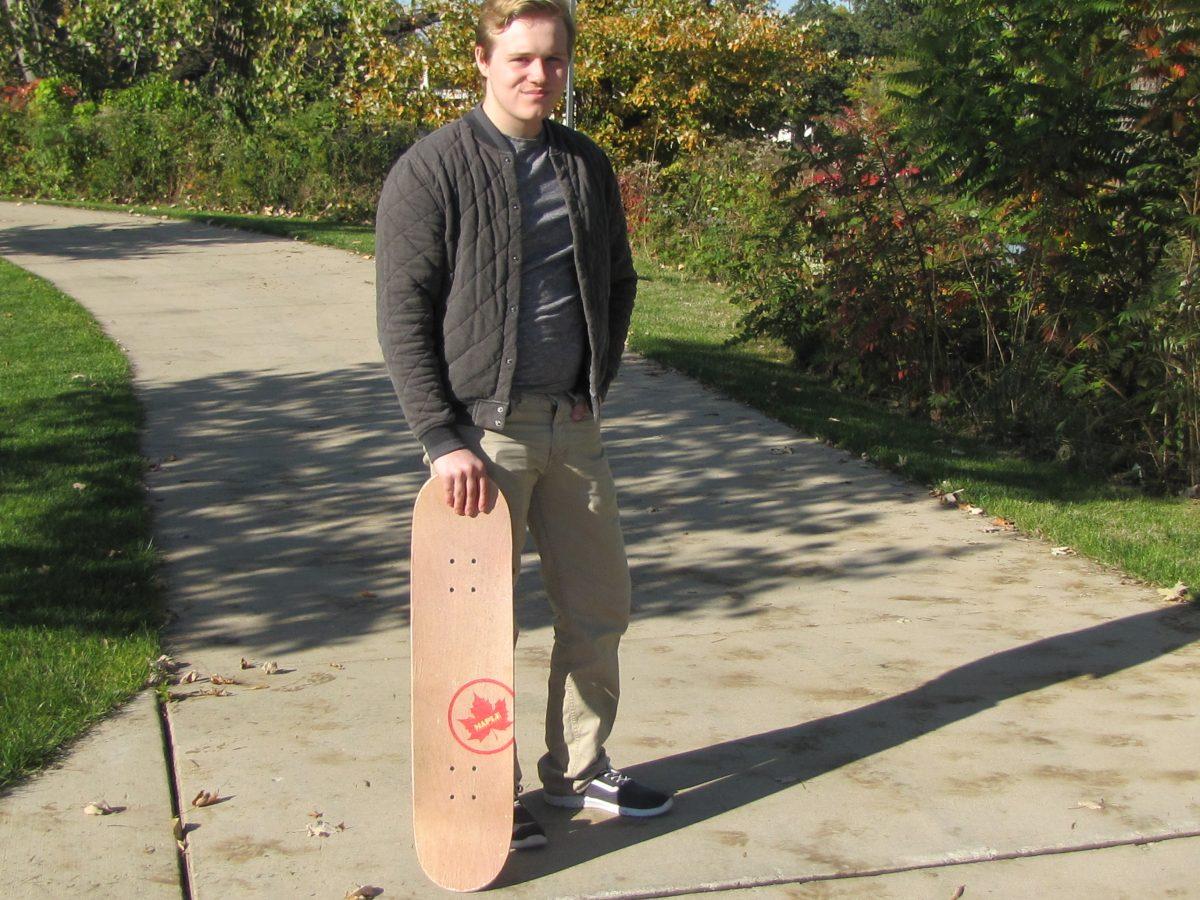 Michael Kirbie, freshmen, poses with his skateboard. He is one of the many who live on campus that own a skateboard.
PHOTO/Kate Luce
