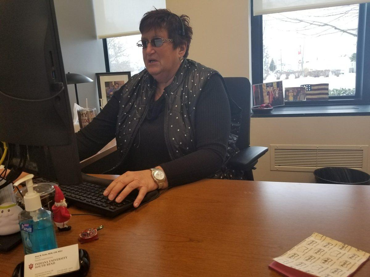 Anne Drake answers an important email at her desk. Photo/CA Printup