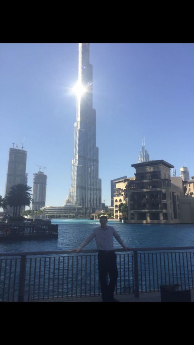 Carter DeJong stands in front of the Burj Khalifa in Dubai, UAE. Photo provided by Carter DeJong.