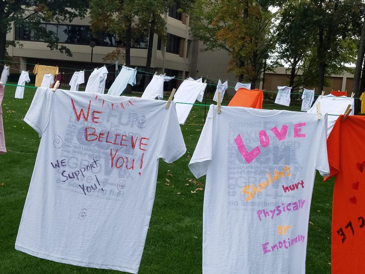 The Feminist Student Union’s 2018 Clothesline Project on display on Greenlawn. The installation works to give voices to the survivors of intimate partner violence. The installation will be in display for two weeks. PHOTO/JOHN LARSON