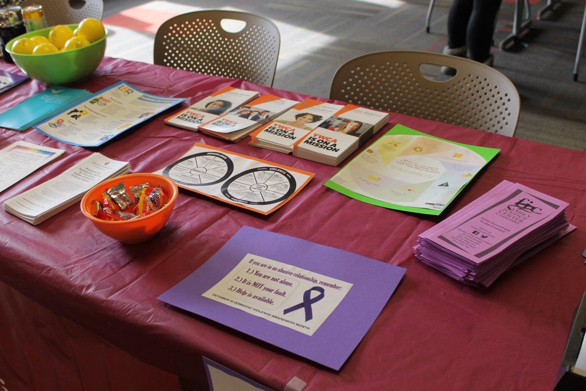 The table set up with information on resources for survivors. Photo By/KATELYN FIRESTEIN
