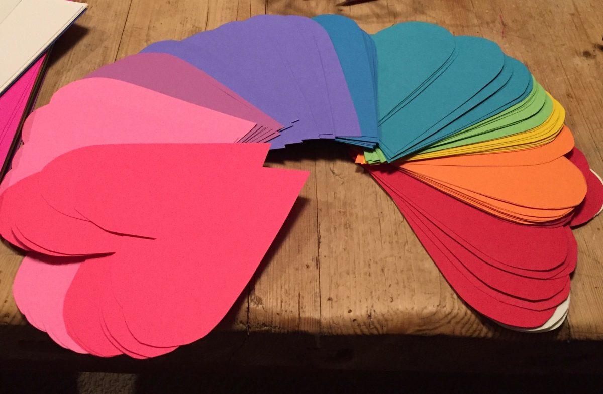 Rainbow hearts cut out to celebrate national coming out day during a QSA meeting. Photo provided by Katelyn Firestein.