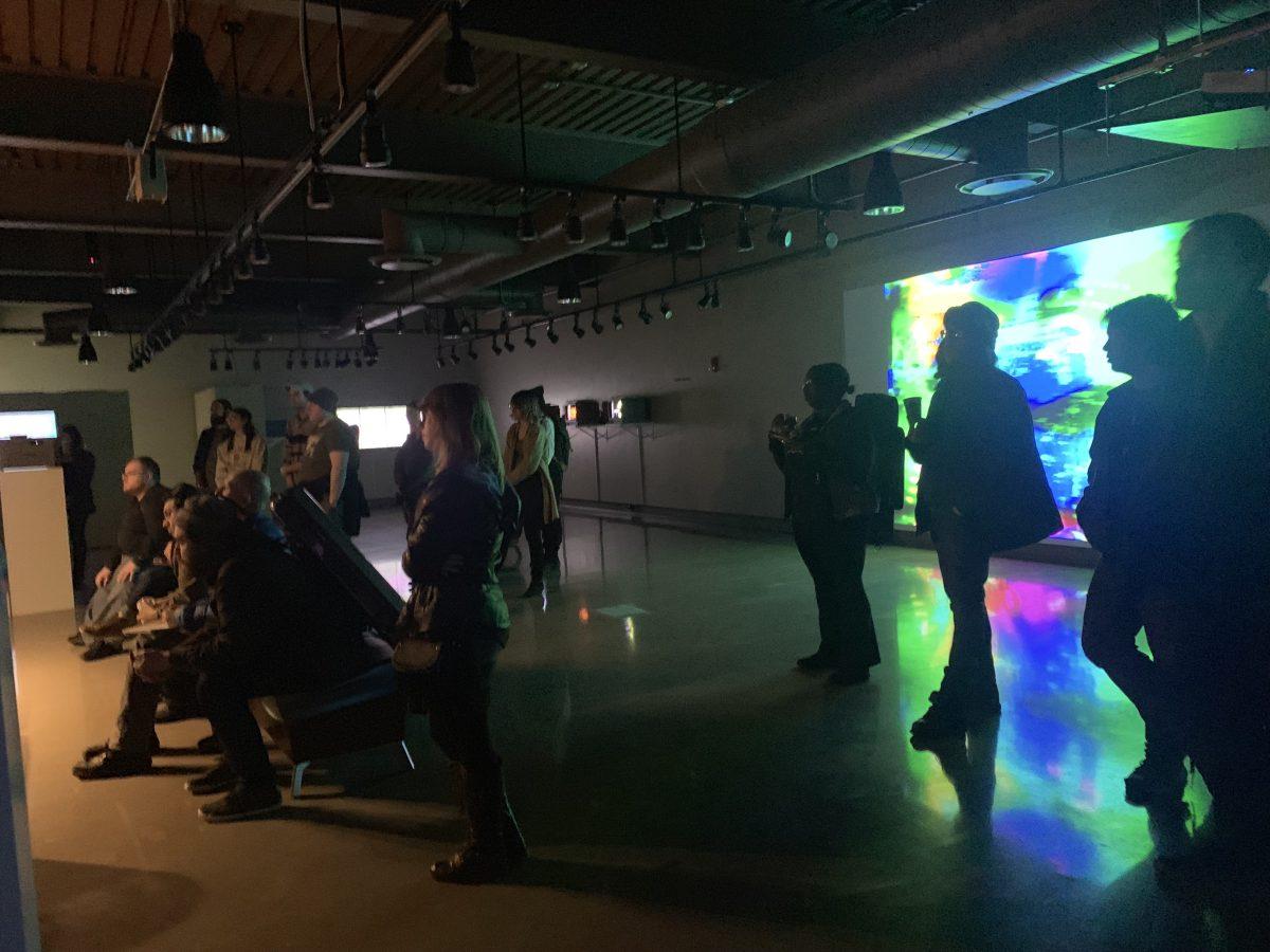 Gallery visitors immerse themselves in the experience of the Performing Media Festival. PHOTO BY/ Kate Luce