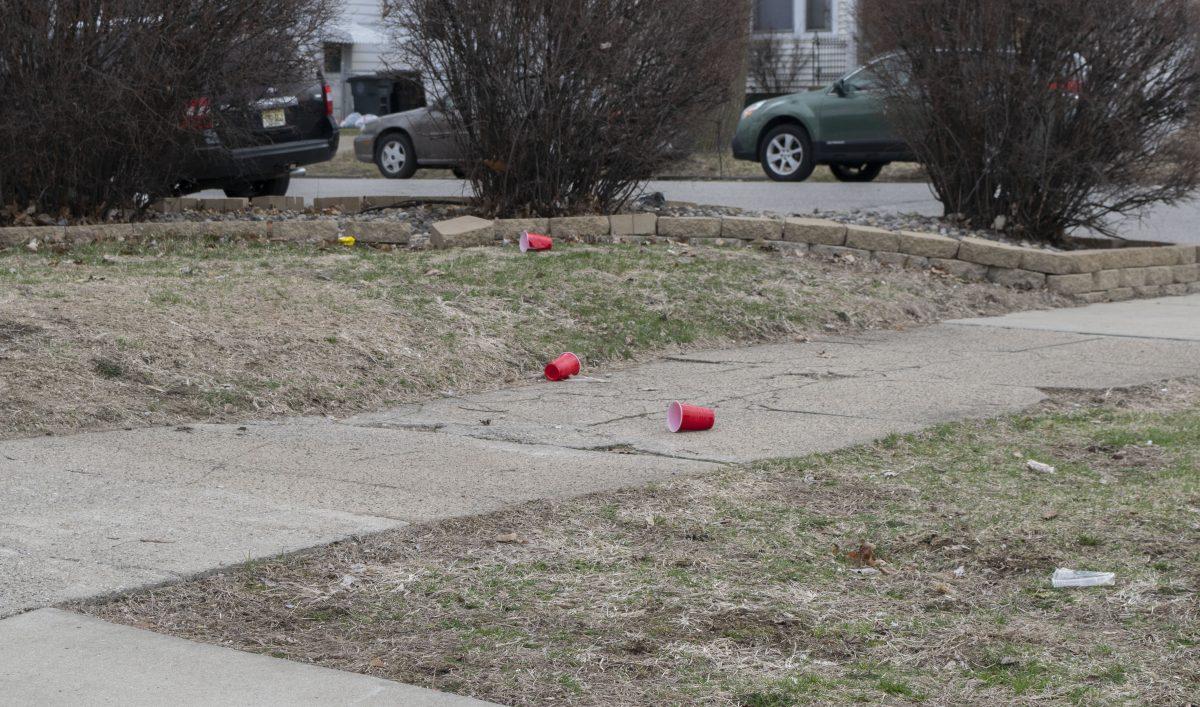 Solo cups litter the lawn of a home at the corner of N. Notre Dame Avenue on March 31. PHOTO BY/Christina Clark