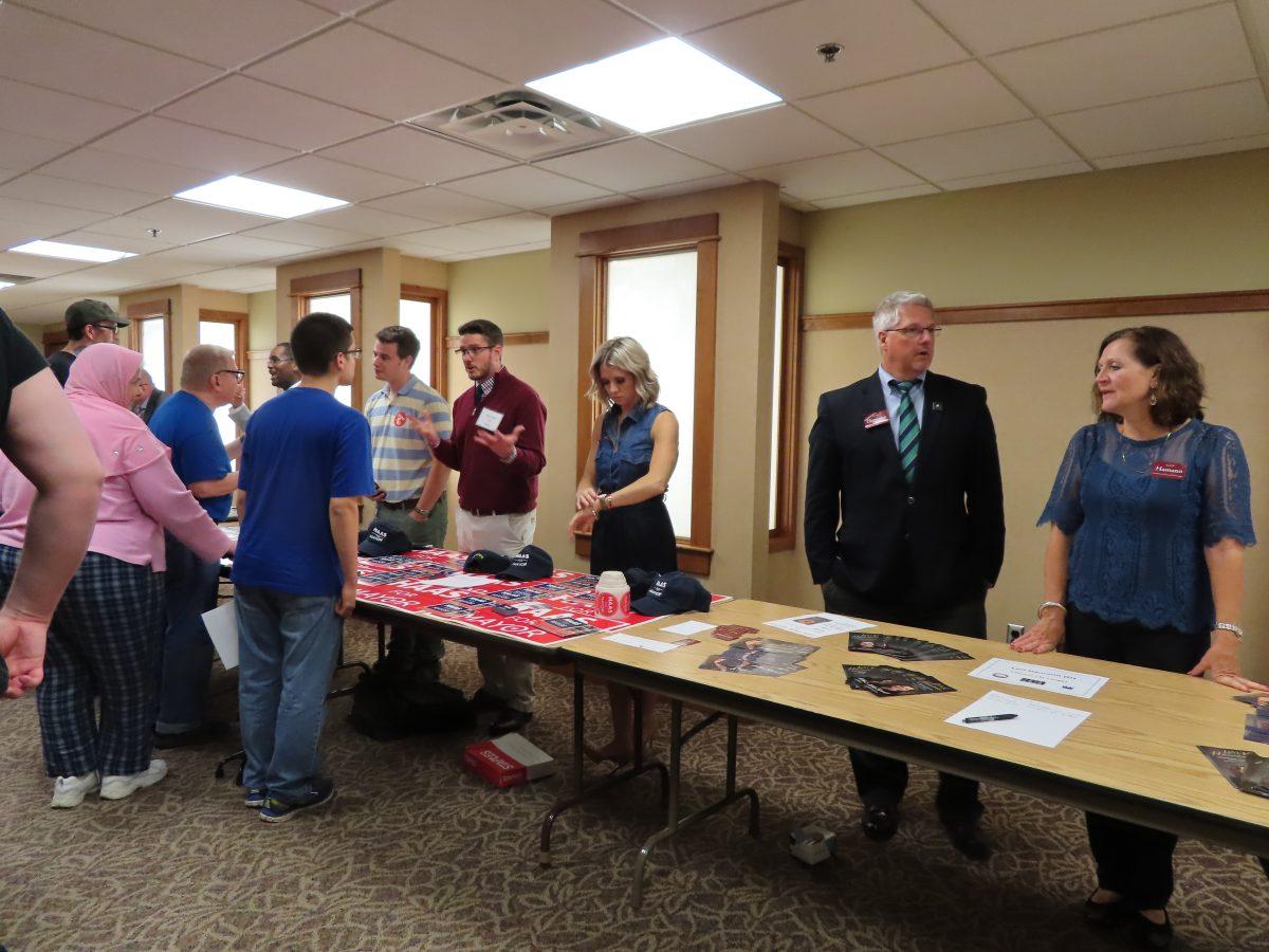 Candidates after the event, speaking with attendees. Photo by/TAYLOR HILL
