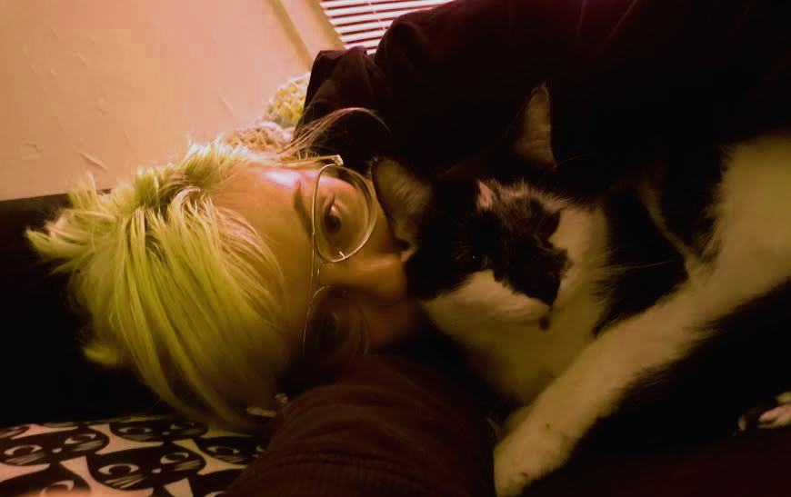 Taylor Hill cuddles her cat, Krispy.