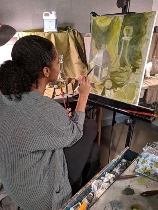 Ariana Peak working on one of her paintings. Photo/Arianna Peak.